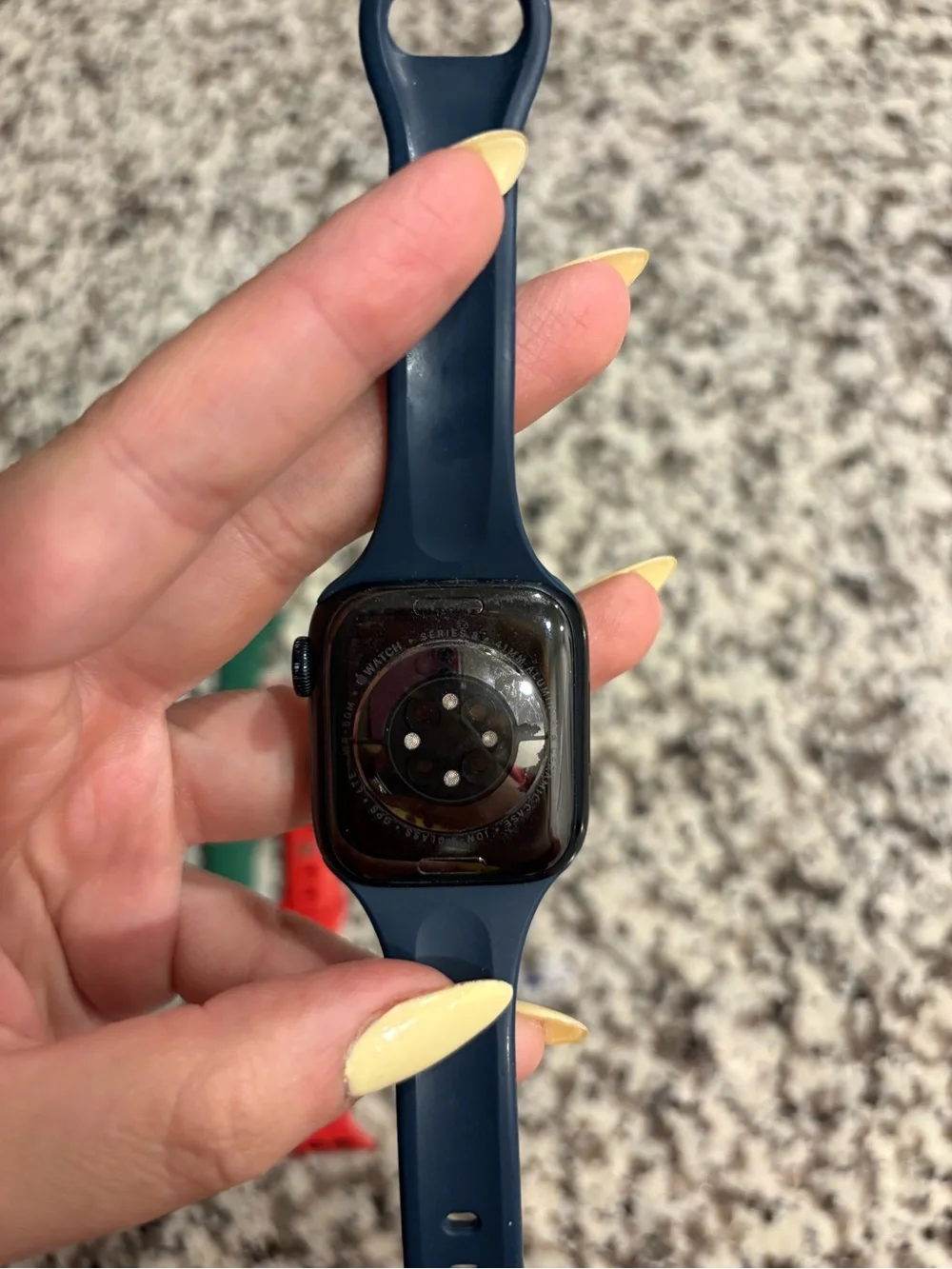 Apple Watch with Navy Case and White/Black, Green, and Red Sport Bands